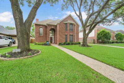 Beautiful front elevation with mature trees