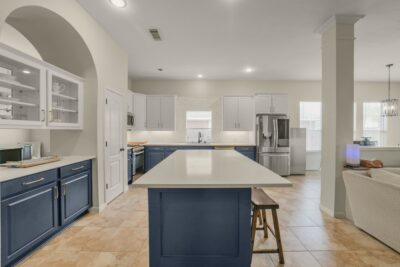 Chef-inspired kitchen featuring stainless steel appliances and extensive storage.