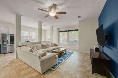 Family room featuring abundant windows and excellent entertaining space.
