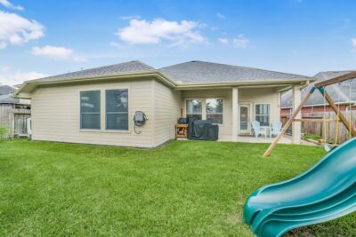 Large backyard with plenty of room for play, pets and gardening,