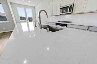 Oversized quartz breakfast island in the kitchen at 2952 Golden Dust Drive in Sunterra