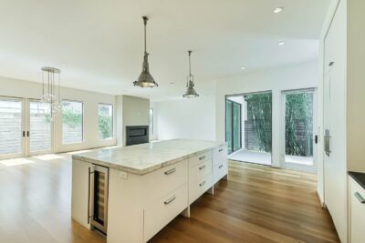 Open-concept kitchen overlooking the living and dining spaces.